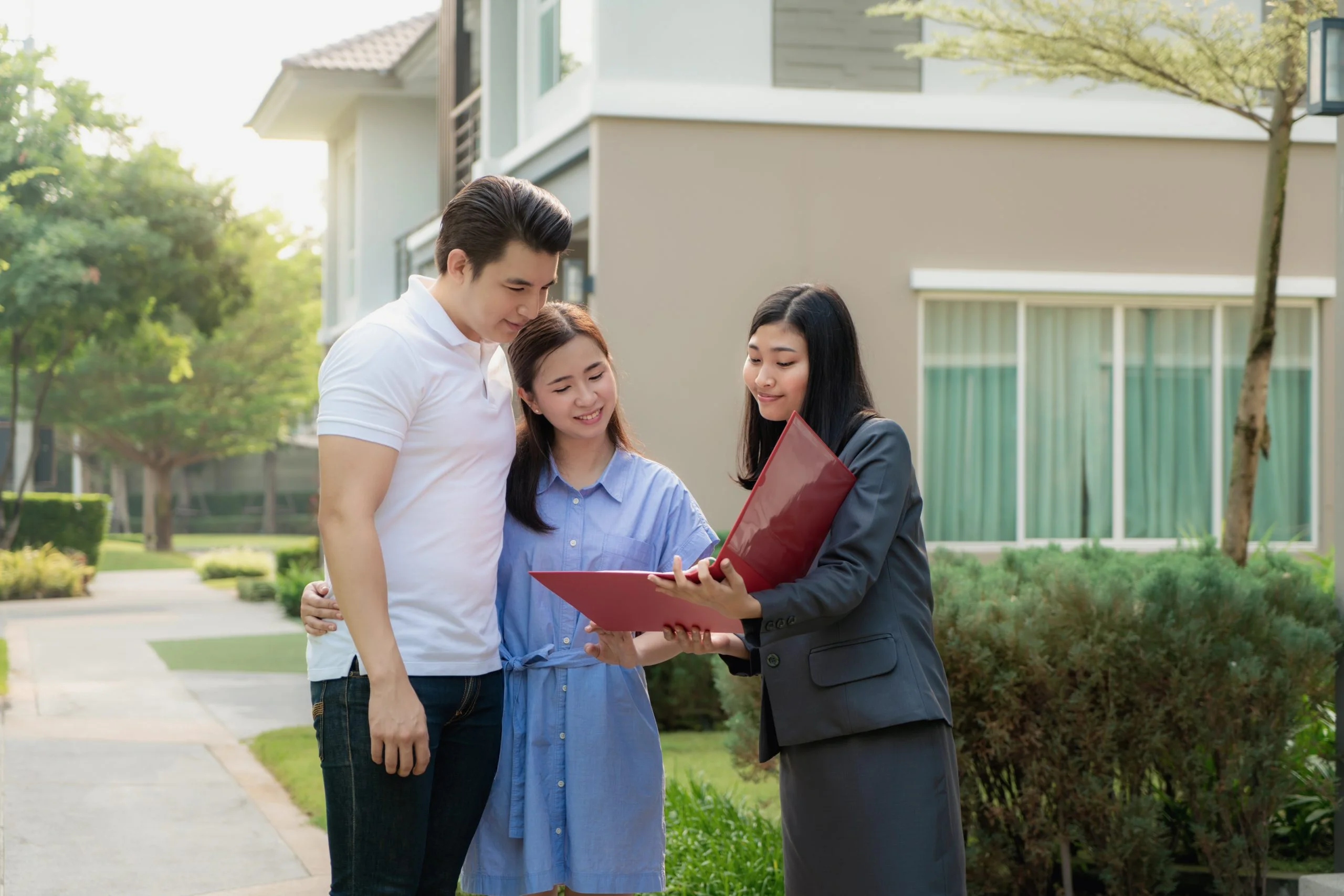 asian woman real estate broker agent showing house detail her file young asian couple lover looking interest buy it scaled 1
