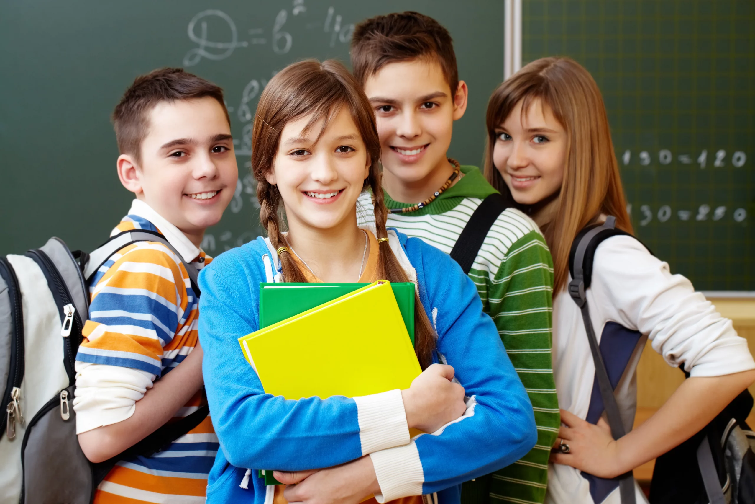 smiling students with backpacks scaled